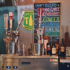 Totem draft beer and wine bottles.